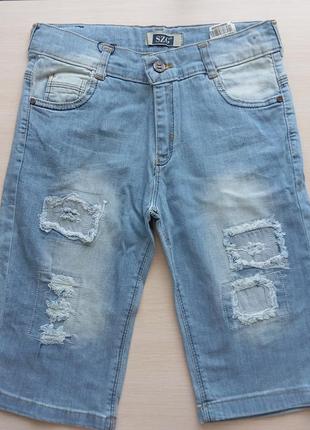 Подовжені джинсові шорти на підлітка