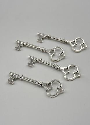 Металеві ключики накладки колір "срібло" 60х20 мм товари для рукоділля та творчості