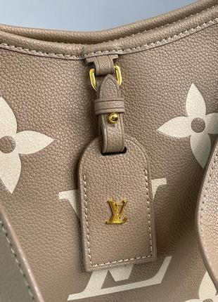 Сумка у стилі louis vuitton carryall pm bicolor monogram empreinte leather beige5 фото