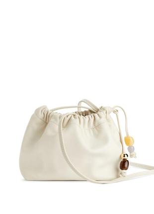 Шкіряна міні-сумочка на зав'язці з декоративними каменями arket 1220104001