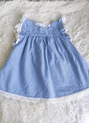 Ошатна пишна сукня у тонку смужку