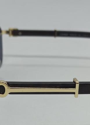 Очки в стиле cartier унисекс солнцезащитные безоправные черные с золотым металлом5 фото