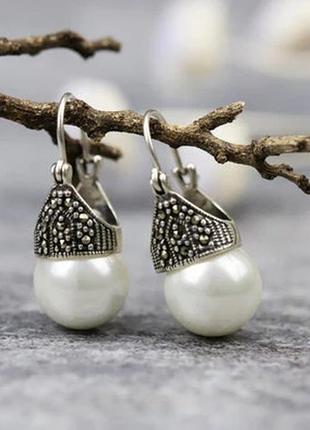 Розкішні срібні сережки з шелл-перлами та марказитами1 фото