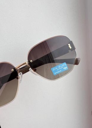 Фирменные солнцезащитные безоправные очки rita bradley polarized rb90267 фото