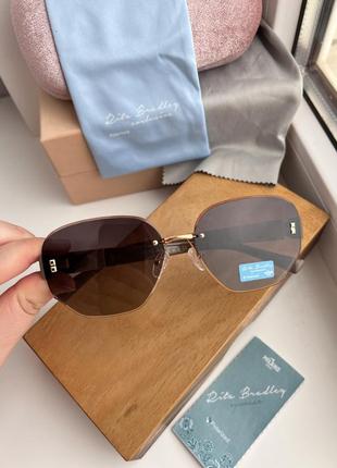 Фирменные солнцезащитные безоправные очки rita bradley polarized rb90268 фото