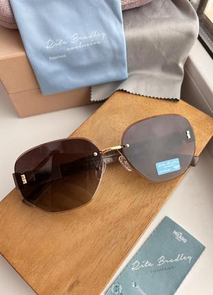 Фирменные солнцезащитные безоправные очки rita bradley polarized rb9026