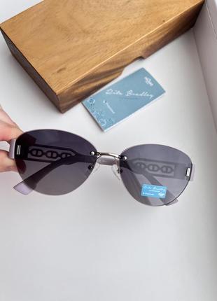 Фирменные солнцезащитные безоправные овальные очки rita bradley polarized rb9029