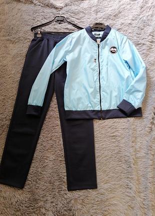 Костюм спортивно прогулочный костюм вітровка без підкладки розмір на бирці вказаний -1 тканина плащі
