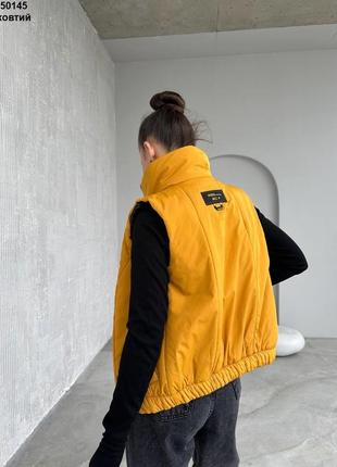 Жилетка безрукавка