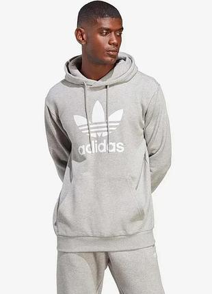 Urbanshop бавовняна кофта adidas originals adicolor classics trefoil hoodie чоловіча колір сірий з капюшоном