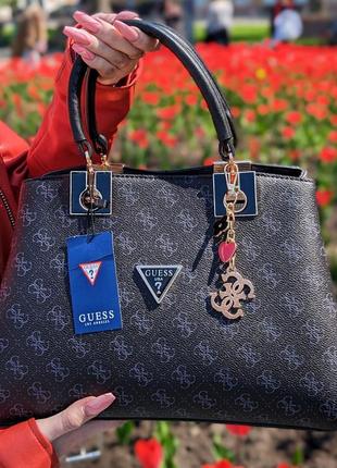 Жіноча сумка «guess» чорна саквояж з ручками, модна містка популярна сумочка чорного кольору тиснення