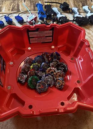 Beyblade burts 18 штук + арена та 13 пускових пристроїв2 фото