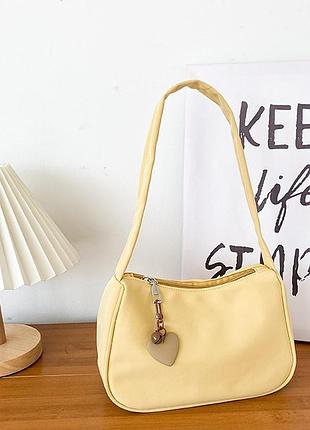Женская сумка с кулоном любви желтая