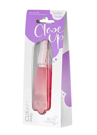 Тримач для соски curaprox babyholder pink, рожевого кольору