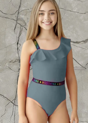 Дитячий і підлітковий суцільний купальник у рубчик на одне плече з воланом teres 964-2 шт.