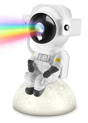 Проектор звездного неба. светильник космонавт сидячий с пультом. bluetooth + динамик