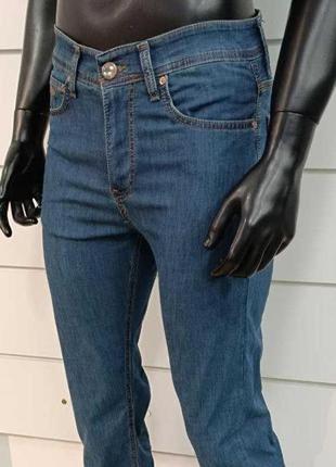 Полегшені чоловічі брендові джинси.