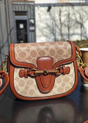 Сумка coach крос боді коричневий є