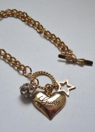 Золотий браслет із серцем зіркою guess