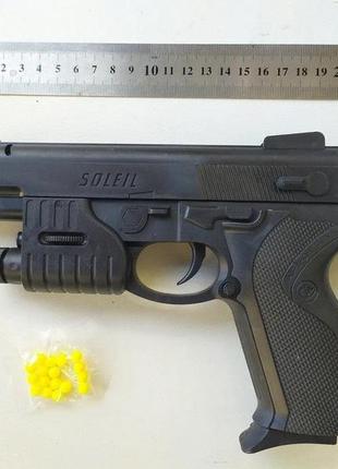 Игрушечный пистолет на пульках арт.р87н с лазерным прицелом, фонарик, размер 22*14см, см. описание2 фото