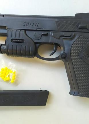 Игрушечный пистолет на пульках арт.р87н с лазерным прицелом, фонарик, размер 22*14см, см. описание9 фото