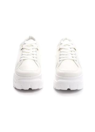 Білі кросівки7 фото