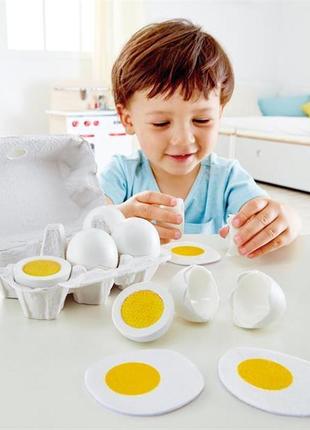 Іграшкові продукти hape дерев'яні яйця в лотку (e3156)