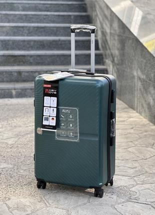Ударопрочный пластиковый большой чемодан дорожный l на колесах 110 литров4 фото