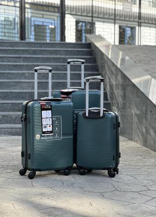 Ударопрочный пластиковый большой чемодан дорожный l на колесах 110 литров3 фото