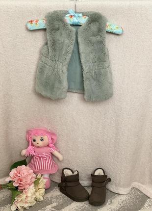 Жилетка, безрукавка