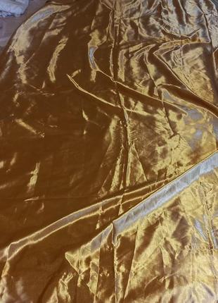 Штора в золотистого кольору