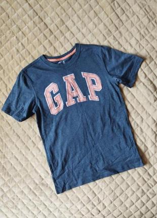 Футболка на 12-13 лет,плечи 37 см, подмышки 40, длина 59 см.