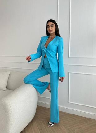 Костюм брючний блакитний