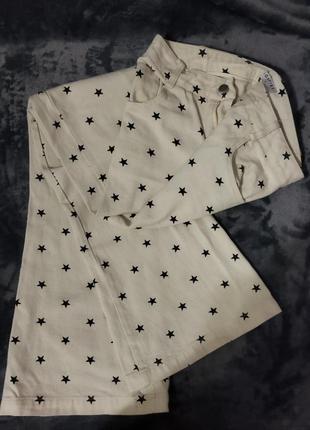 Джинсы клеш