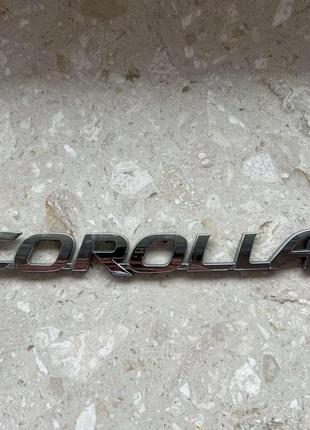 Шильдик напис corolla  на кришку багажника оригінал