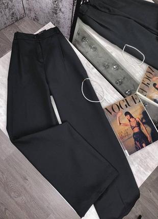 Чорні жіночі широкі брюки палаццо1 фото
