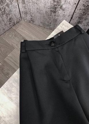 Чорні жіночі широкі брюки палаццо9 фото