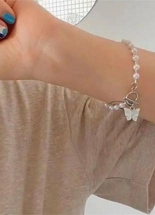 Браслет с бусинами бабочка