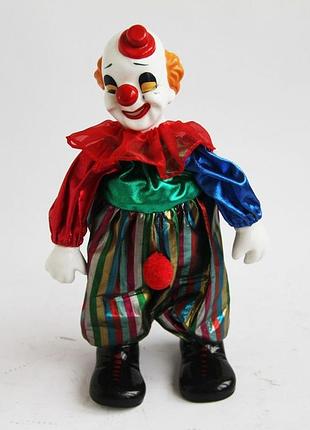 Старовинна колекційна порцелянова лялька-клоун, заводний ключ, що грає мелодію