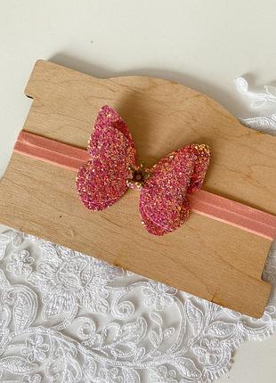 Глітерний з екошкіри бант з короною на повязці.