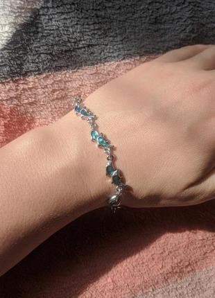 Серебряный браслет с абаллоном в виде дельфинов