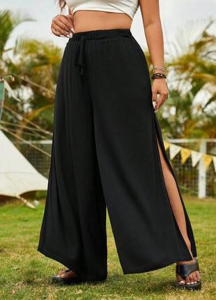 Легенькі штани палацоцо з розрізами по боках