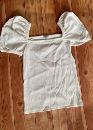 Біла блуза в рубчик