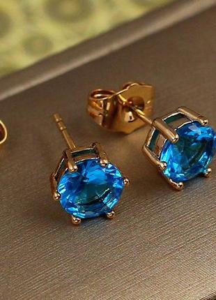 Серьги гвоздики xuping jewelry  с голубым камнем шесть креплений 7 мм золотистые