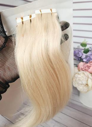 Натуральний волос для нарощування блонд на стрічках.2 фото