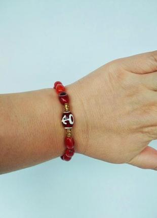 Браслет - амулет из камня сердолик  с бусиной дзи " большой человек"2 фото