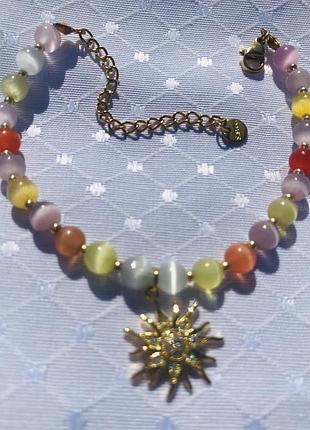 Захисний браслет з каменю котяче око та симоволом життя сонця