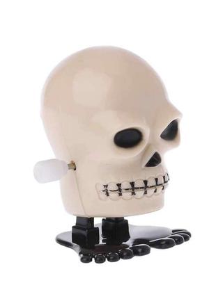 Заводна іграшка череп