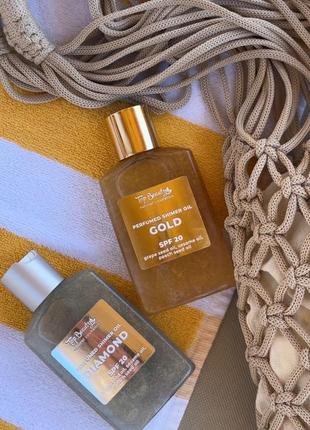 Суха  парфумована олійка для засмаги із фактором захисту spf 20 (°°