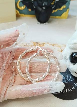 Серьги крупные серебристые вычурные кольца